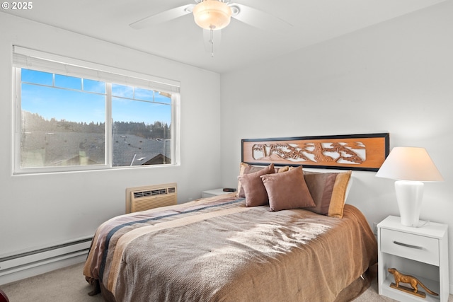 carpeted bedroom featuring a baseboard radiator, a wall unit AC, and ceiling fan