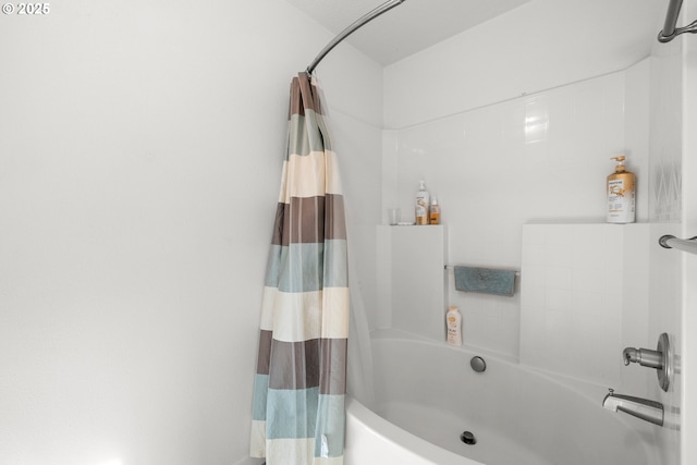 bathroom with shower / bath combination with curtain