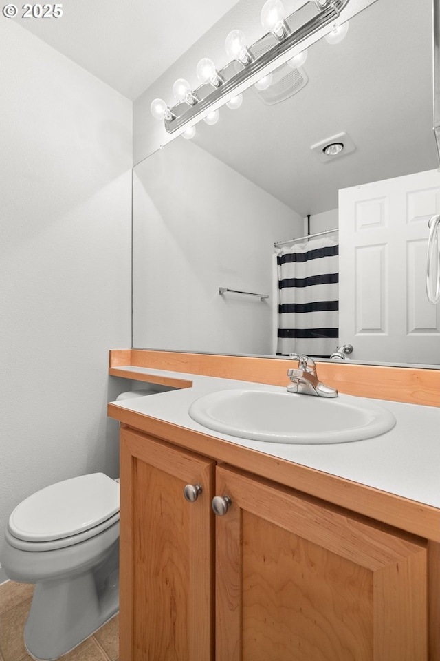 full bathroom featuring visible vents, a shower with shower curtain, toilet, tile patterned flooring, and vanity