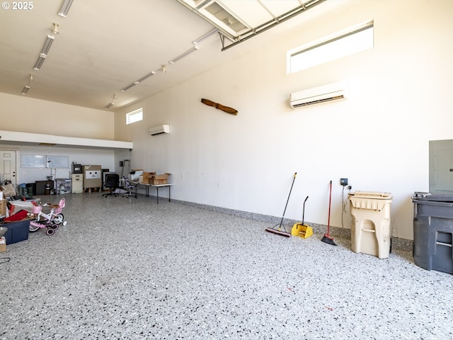3111 Bartley Pl, Albany, OR 97322 - garage with a wall mounted AC, electric panel, and a wall unit AC