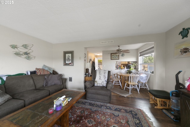 625 Crestview Dr, Reedsport, OR 97467 - living room with hardwood / wood-style flooring, a ceiling fan, and a textured ceiling