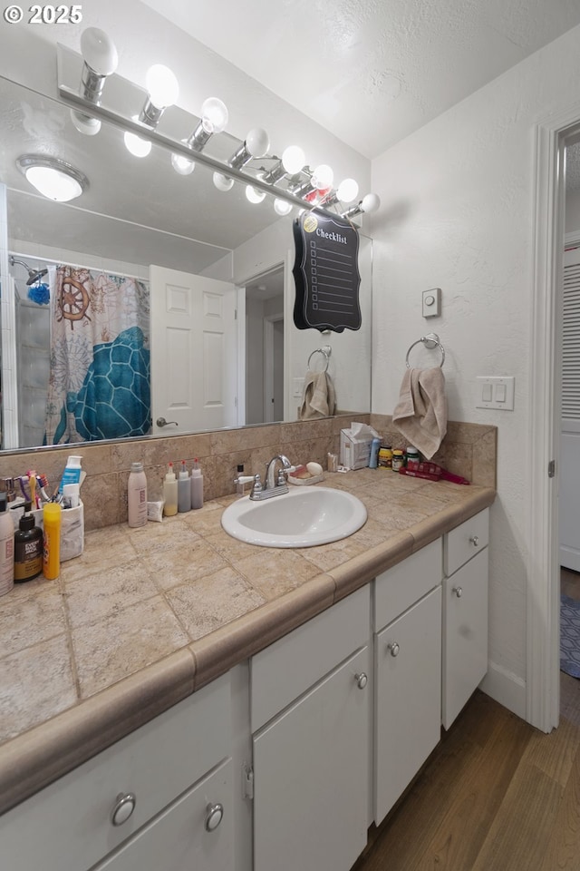 625 Crestview Dr, Reedsport, OR 97467 - full bath with vanity, wood finished floors, and a shower with curtain