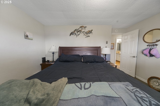 625 Crestview Dr, Reedsport, OR 97467 - carpeted bedroom with a textured ceiling and baseboards