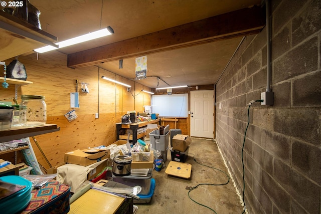 625 Crestview Dr, Reedsport, OR 97467 - miscellaneous room featuring unfinished concrete flooring, a workshop area, and concrete block wall