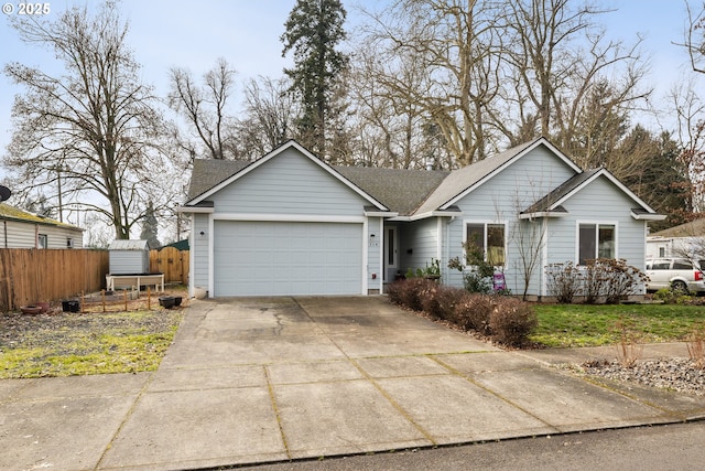 ranch-style home featuring a shingled roof, driveway, an attached garage, and fence