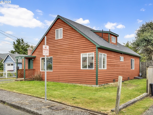 view of home's exterior featuring a shingled roof