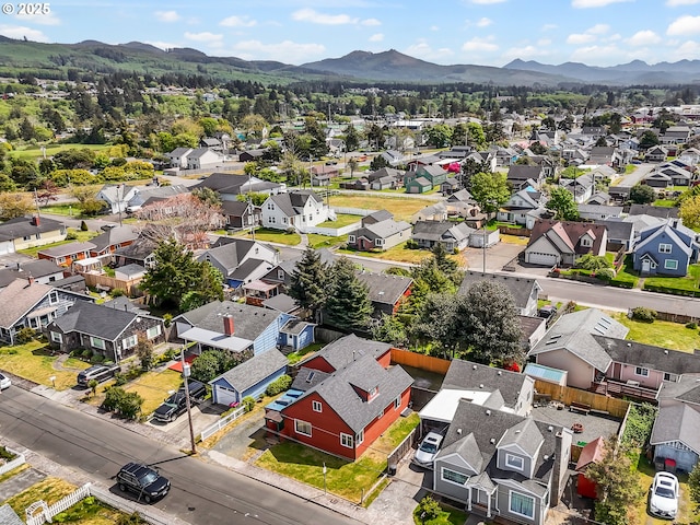 aerial perspective of suburban area with mountains