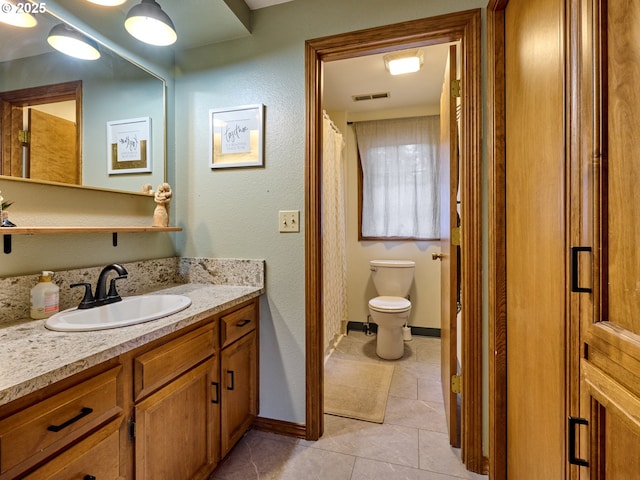 full bath with visible vents, baseboards, toilet, tile patterned floors, and vanity