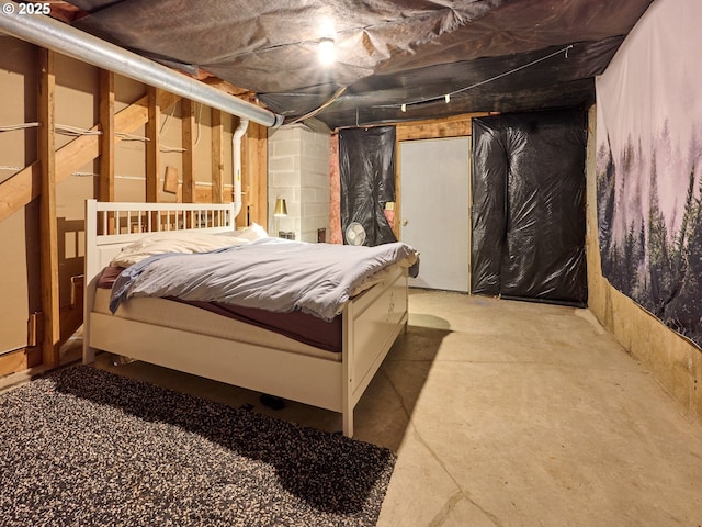 bedroom with unfinished concrete floors