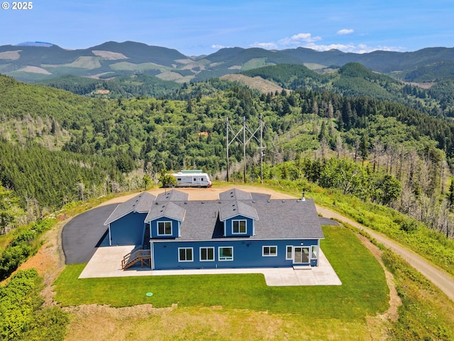 1091 N Echo Mountain Rd, Otis, OR 97368 - aerial view of property and surrounding area featuring a forest and mountains