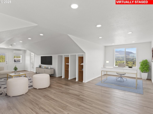 1091 N Echo Mountain Rd, Otis, OR 97368 - living area with wood finished floors, recessed lighting, healthy amount of natural light, a desk, and a textured ceiling