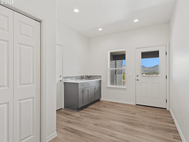 1091 N Echo Mountain Rd, Otis, OR 97368 - laundry area with light wood finished floors and recessed lighting