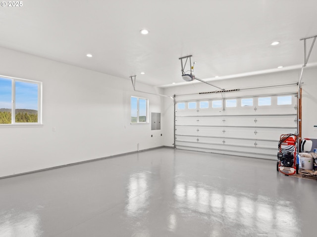 1091 N Echo Mountain Rd, Otis, OR 97368 - garage featuring electric panel, a garage door opener, and recessed lighting
