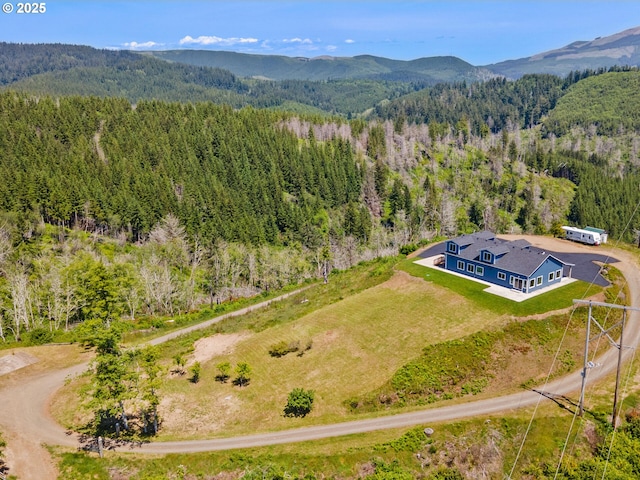 1091 N Echo Mountain Rd, Otis, OR 97368 - aerial view of property and surrounding area featuring a heavily wooded area and mountains