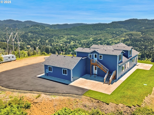 1091 N Echo Mountain Rd, Otis, OR 97368 - view from above of property featuring mountains and a heavily wooded area