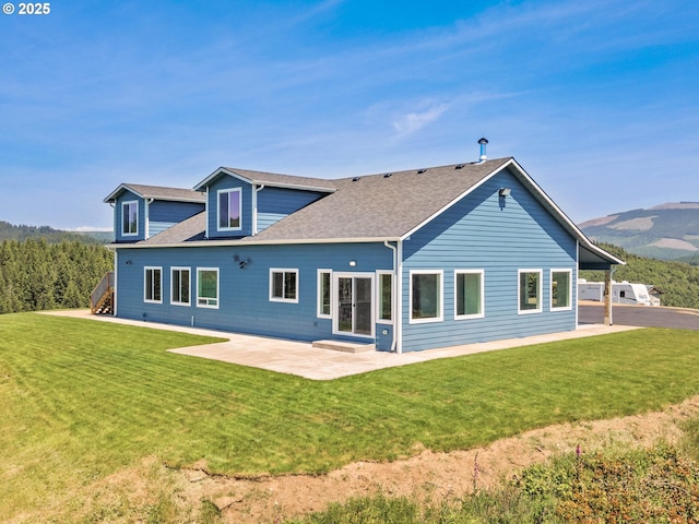 1091 N Echo Mountain Rd, Otis, OR 97368 - back of house with a patio, a lawn, and stairs