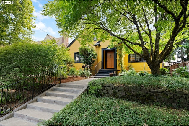 436 SE 44th Ave, Portland, OR 97215 - view of property hidden behind natural elements featuring stucco siding