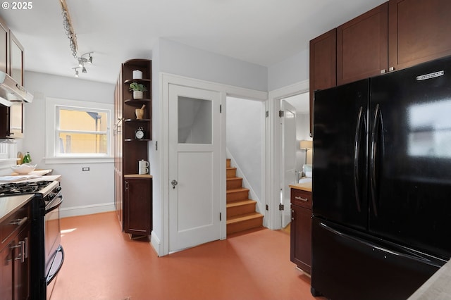 436 SE 44th Ave, Portland, OR 97215 - kitchen featuring black appliances, light countertops, dark brown cabinets, and extractor fan