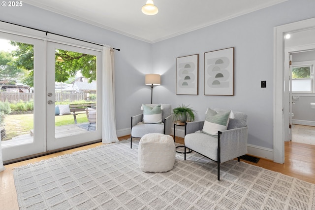 436 SE 44th Ave, Portland, OR 97215 - living area with crown molding and light wood finished floors