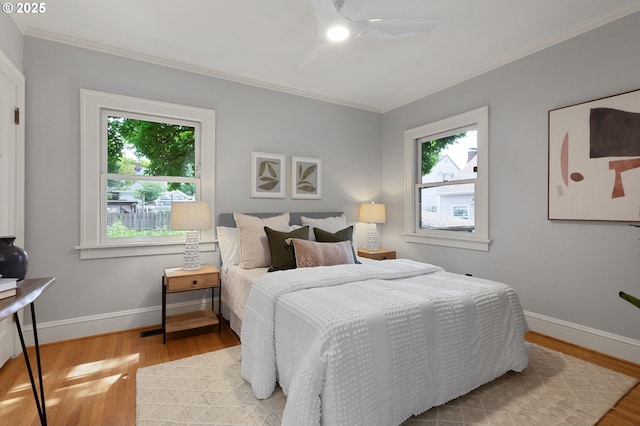 436 SE 44th Ave, Portland, OR 97215 - bedroom featuring ornamental molding, light wood-type flooring, and ceiling fan