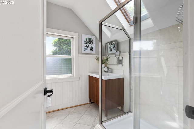 436 SE 44th Ave, Portland, OR 97215 - full bathroom featuring vanity, lofted ceiling, a shower stall, tile patterned flooring, and a skylight