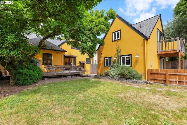 436 SE 44th Ave, Portland, OR 97215 - rear view of house featuring stucco siding, a deck, and roof with shingles