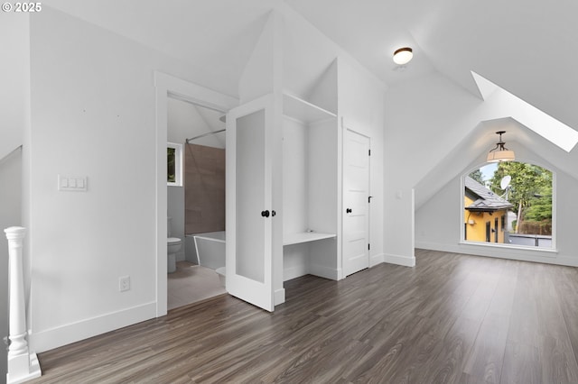436 SE 44th Ave, Portland, OR 97215 - additional living space with lofted ceiling, wood finished floors, and a skylight