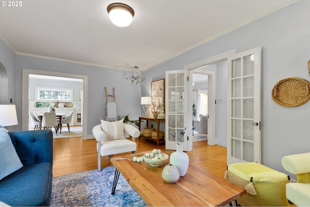 436 SE 44th Ave, Portland, OR 97215 - living area featuring french doors, wood finished floors, ornamental molding, and arched walkways