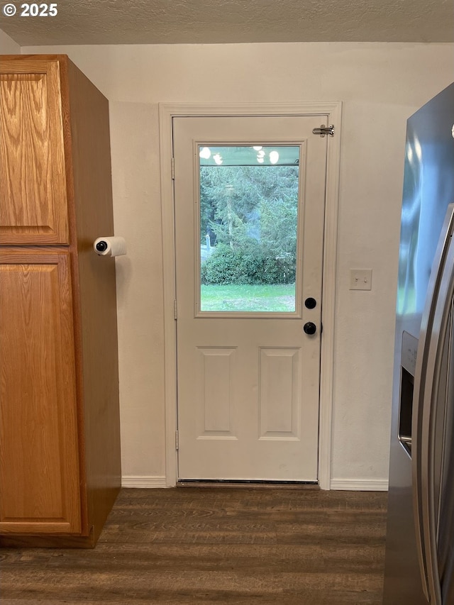 doorway with dark hardwood / wood-style floors