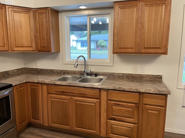 kitchen with sink and stainless steel range with electric cooktop