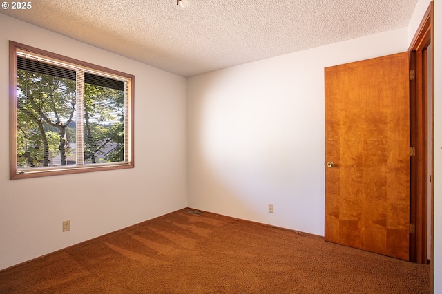 555 W 26th Ave, Eugene, OR 97405 - carpeted spare room with a textured ceiling