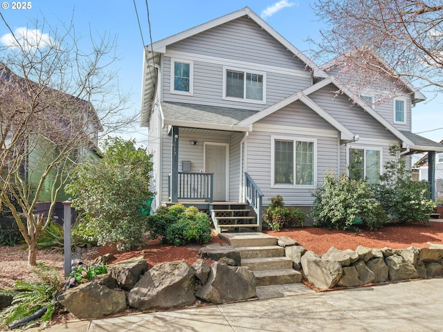 view of front of house with a porch and roof with shingles