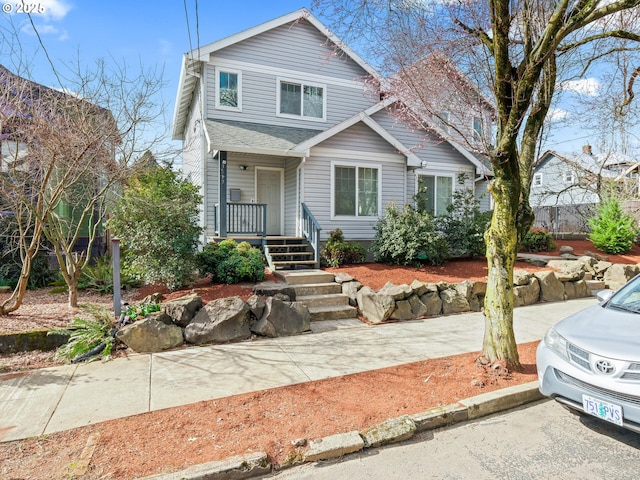 view of front of house with a shingled roof