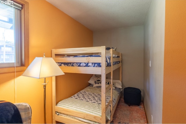 26750 David Ave, Rockaway Beach, OR 97136 - bedroom featuring a textured ceiling