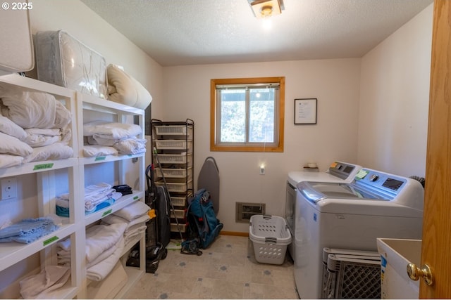 26750 David Ave, Rockaway Beach, OR 97136 - clothes washing area featuring washer and dryer and baseboards