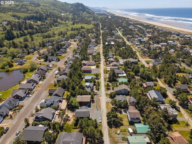 26750 David Ave, Rockaway Beach, OR 97136 - aerial overview of property's location with nearby suburban area and a large body of water