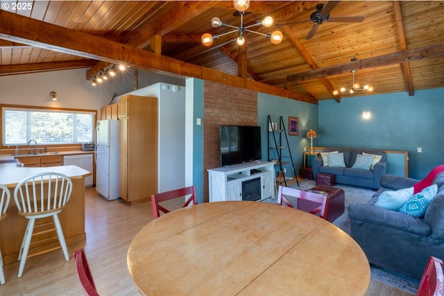 26750 David Ave, Rockaway Beach, OR 97136 - dining space with wood ceiling, light wood finished floors, a fireplace, ceiling fan, and a chandelier