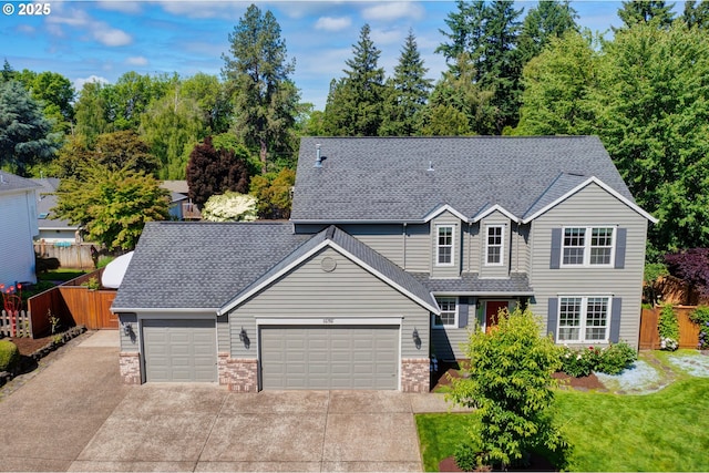 11287 SW 112th Ave, Tigard, OR 97223 - traditional-style house featuring an attached garage, concrete driveway, and a shingled roof