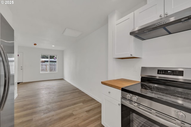 4070 Barger Dr, Eugene, OR 97402 - kitchen with appliances with stainless steel finishes, ventilation hood, white cabinetry, light wood-style floors, and wooden counters