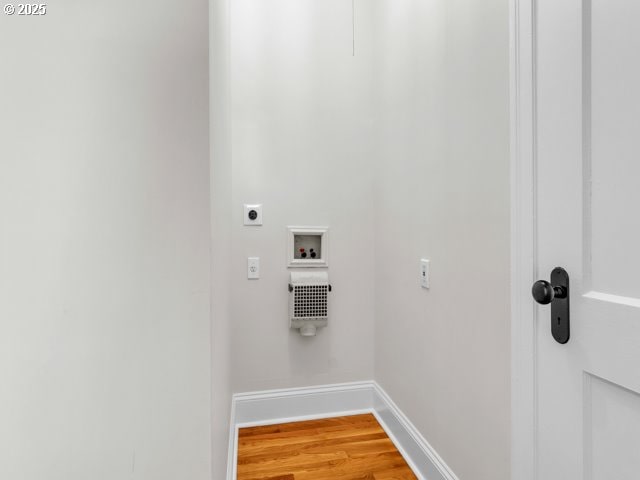 20 NW 16th Ave Unit 8, Portland, OR 97209 - laundry area featuring laundry area, light wood-style floors, hookup for a washing machine, electric dryer hookup, and baseboards