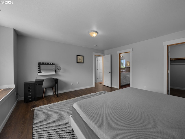 10727 NE Beech St, Portland, OR 97220 - bedroom with wood finished floors, a walk in closet, and ensuite bath