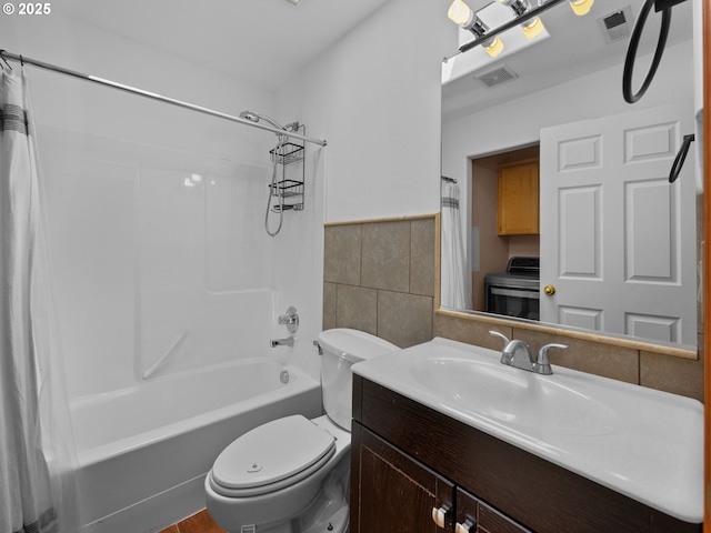 10727 NE Beech St, Portland, OR 97220 - bathroom with washer / clothes dryer, tile walls, shower / bathtub combination with curtain, vanity, and a wainscoted wall