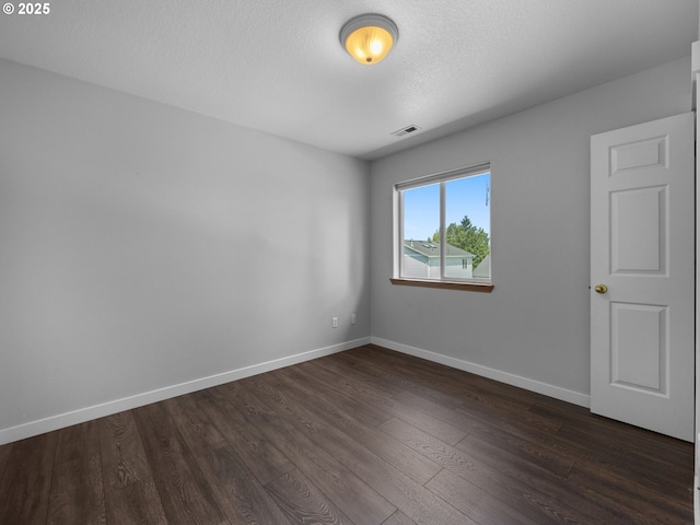 10727 NE Beech St, Portland, OR 97220 - spare room with dark wood finished floors and a textured ceiling
