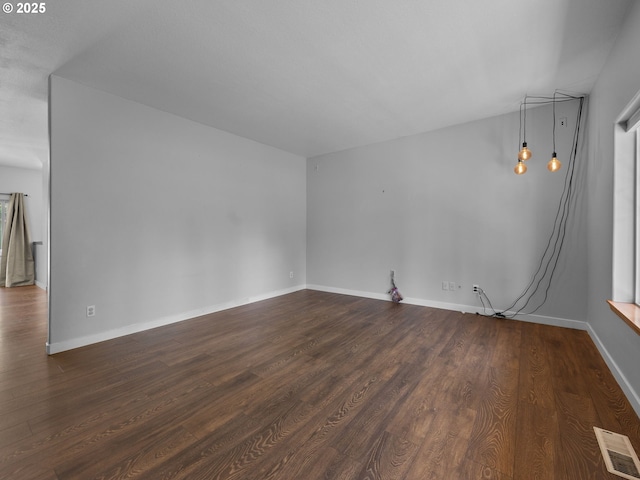 10727 NE Beech St, Portland, OR 97220 - unfurnished room with dark wood-style flooring and baseboards