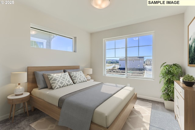 bedroom featuring multiple windows, carpet flooring, and baseboards