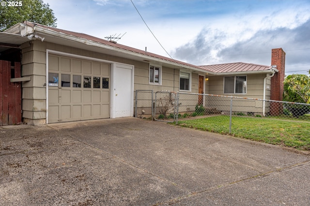 single story home featuring a fenced front yard, a chimney, metal roof, a garage, and driveway