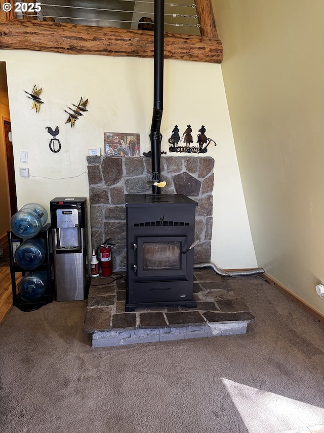 87 Adams Loop Rd, Goldendale, WA 98620 - interior details with a fire extinguisher, carpet floors, and a wood stove