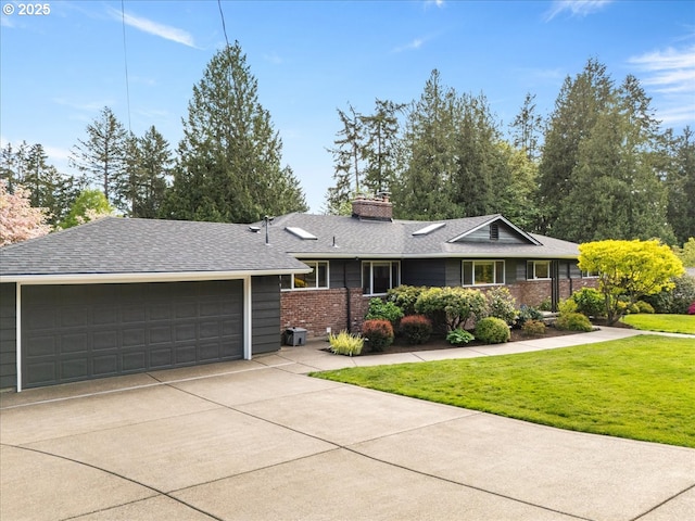 ranch-style home featuring a garage, a front lawn, a chimney, brick siding, and driveway