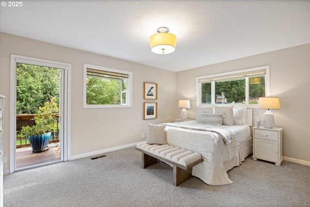 bedroom featuring access to outside, baseboards, visible vents, and light carpet