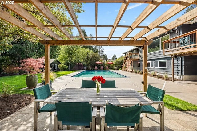 outdoor pool featuring fence, a pergola, outdoor dining area, a patio, and a yard
